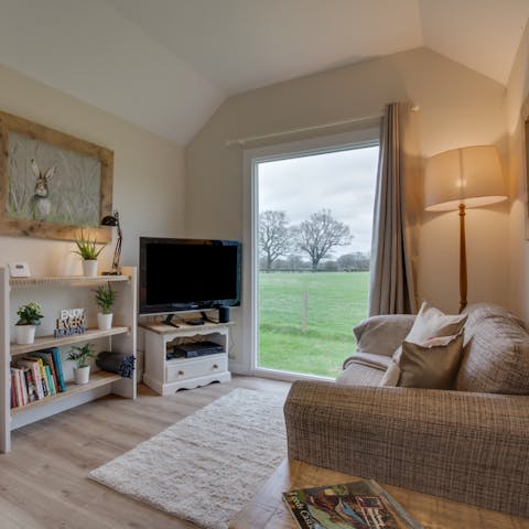 Cosy up in the snug living room after a day of taking in the fresh country air 