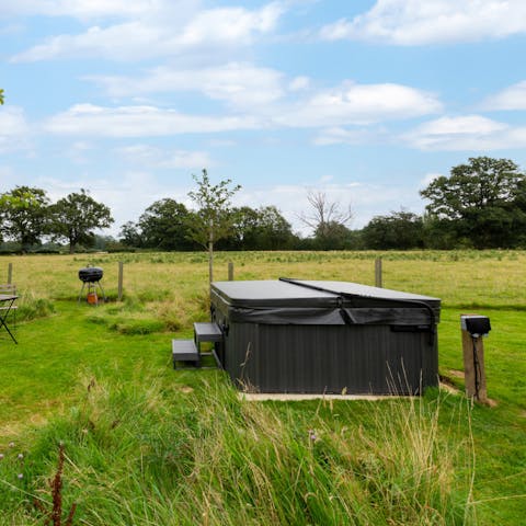 Unwind in the hot tub surrounded by endless views of the surrounding nature