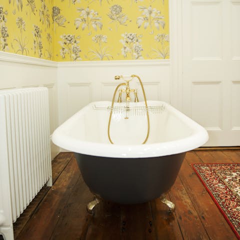 Sink back into steamy water in the elegant clawfoot bathtub