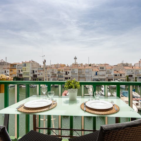 Watch moored boats bob on the water as you tuck into breakfast on your balcony