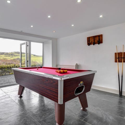 Play a few rounds of pool in the shared games room