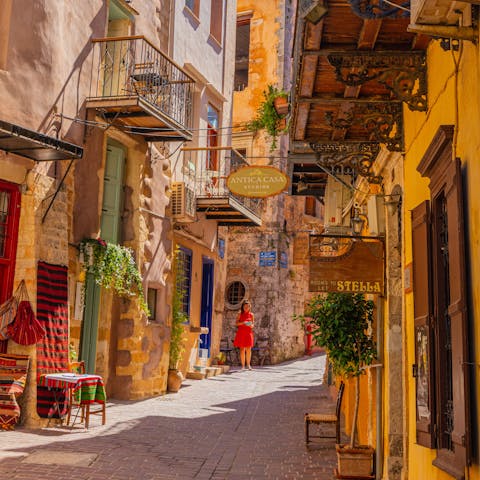 Explore the narrow lanes and alleyways of Chania's atmospheric old town, a short drive away