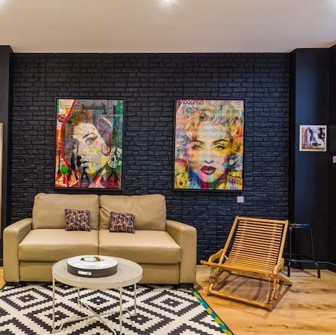 Take in the home's colourful pop art as you relax in the living area