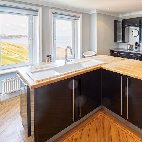 Enjoy the view of the sweeping sand and sea from the sleek kitchen