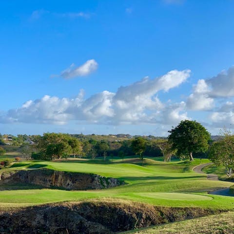 Tee off at the 18-hole championship golf course located on the complex