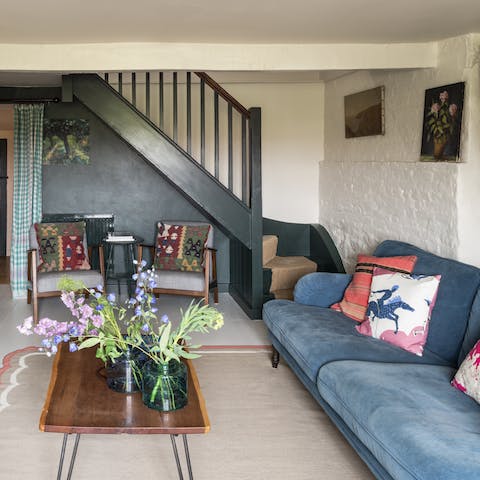 Make yourself at home in the cosy living area and lounge with a good book in front of the fire