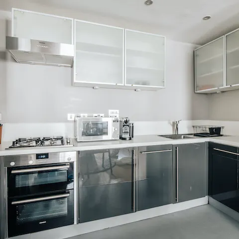 Whip up a hot dinner of bangers and mash in the sleek kitchen