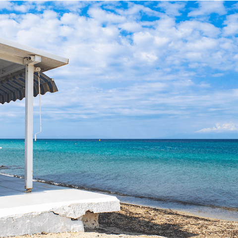 Spend a day at the nearby Fourka beach, just a seven-minute walk away 