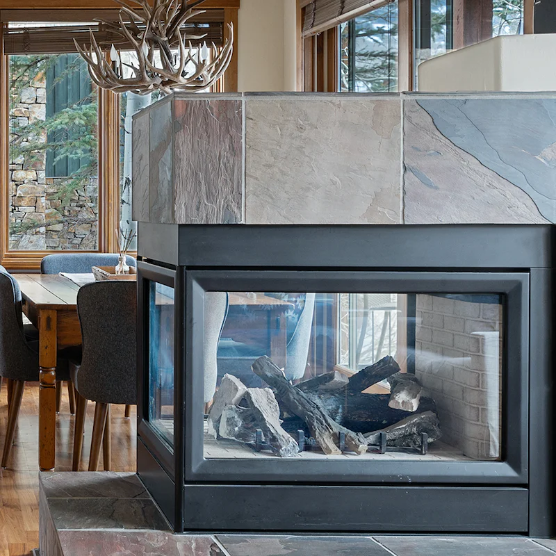 Warm up by the striking, three-sided fireplace