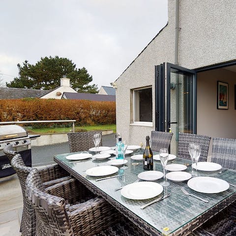 Gather around the terrace dining area for a barbecue in the sunshine