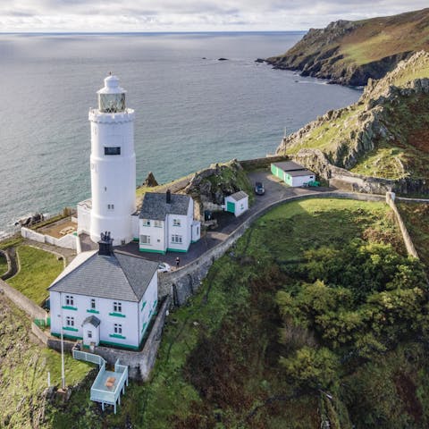 Experience staying in a cottage adjacent to a historic lighthouse 