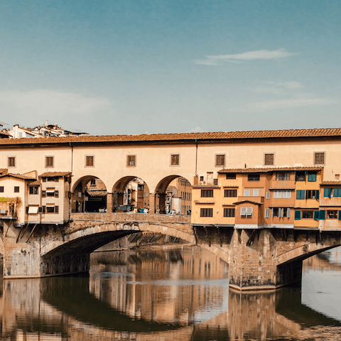 Admire the artisanal stores and iconic buildings on the way to Ponte Vecchio – just ten–minutes away