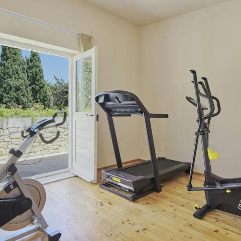 Get fit or start a new workout routine in the well-equipped home gym