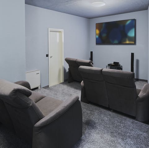 Gather in the home cinema to watch your favourite movies on the big screen