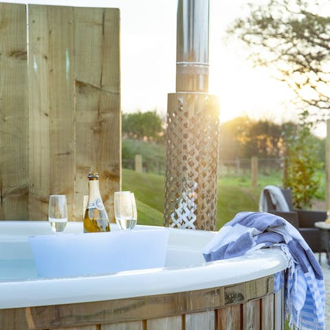 Raise a glass to relaxation in the wood-fired hot tub