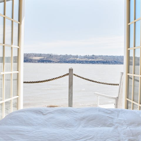 Enjoy peaceful moments with river views from your bedroom