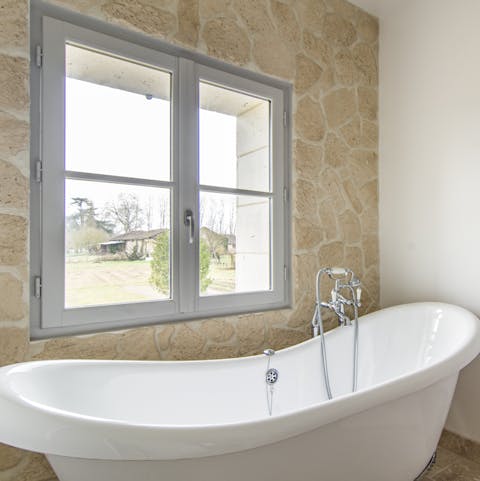 We do love a tub with a view, especially if it's as pretty as the one from this home