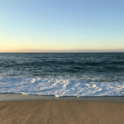 Catch the sunset from the beach bars of Cala Bassa, just one kilometre away