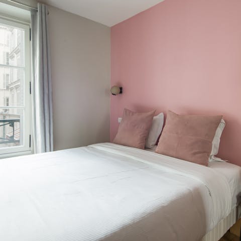 Wake up to 8th arrondissement views in the pretty pink bedroom