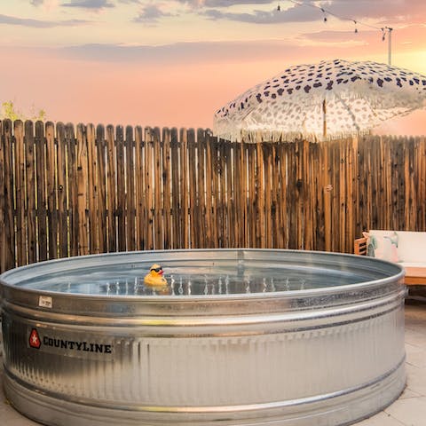 Soak in the cool cowboy tin pool as the sun goes down