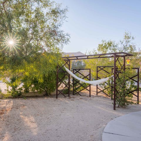 Hang out on the hammock with a book and an ice-cold beverage