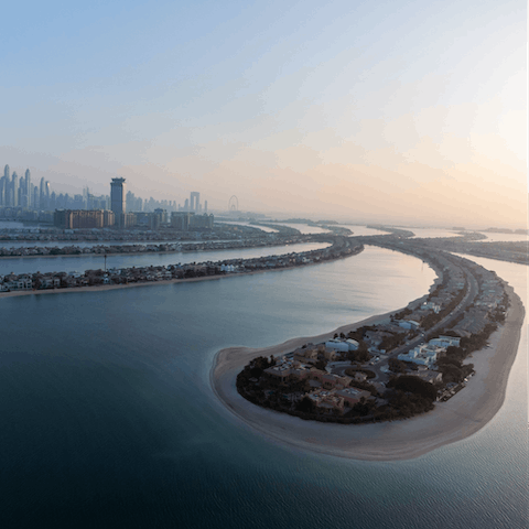 Stay on the iconic Palm Jumeirah, a tree-shaped island with fine restaurants