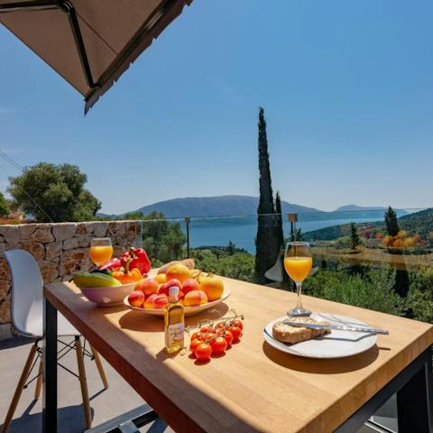 Serve up some local Greek delicacies before the serene views on the balcony