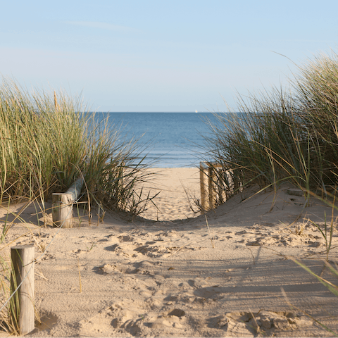 Take a four-minute walk down to the sandy shoreline of Looe Beach
