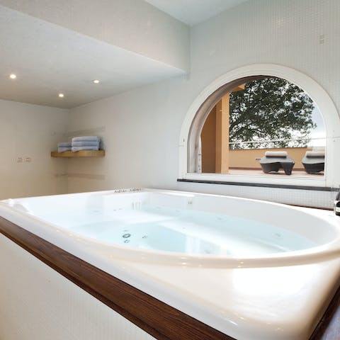 Unwind and decompress with a soak in the Jacuzzi pool 