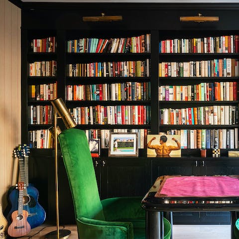 Pluck a guitar, play cards, or pick a book off the shelf in the second lounge