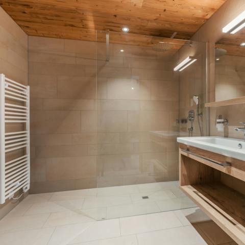 Spend a while under the steamy, rainfall shower after an exhausting day of snowsports
