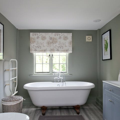 Treat yourself to a long soak in the elegant freestanding bathtub