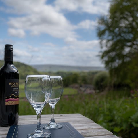Take in the stunning country views over a glass of wine