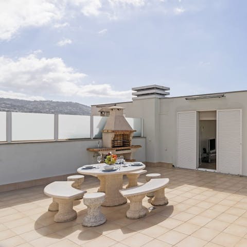 Enjoy Madeira's year-round warm climate on the private roof terrace