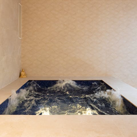 Sit back and relax after a swim in the bubbling Jacuzzi 