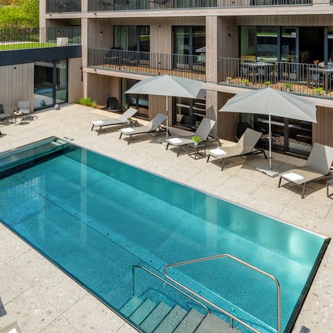 Relax by the communal pool accessible directly from your apartment 