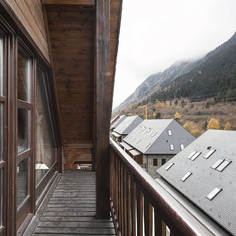 Sip your morning coffee on the balcony, overlooking the snow-topped mountains