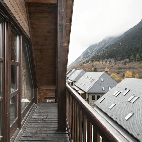 Sip your morning coffee on the balcony, overlooking the snow-topped mountains