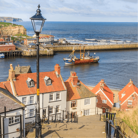 Cross the River Esk and climb the famous 199 steps for stunning views of Whitby