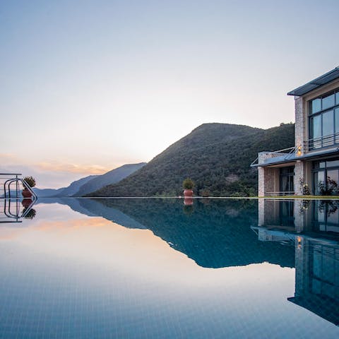 Watch the sunset from the edge of the infinity pool