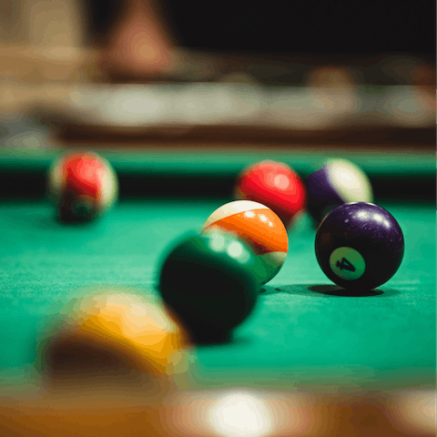 Rack up the balls and challenge your loved ones to a game of billiards