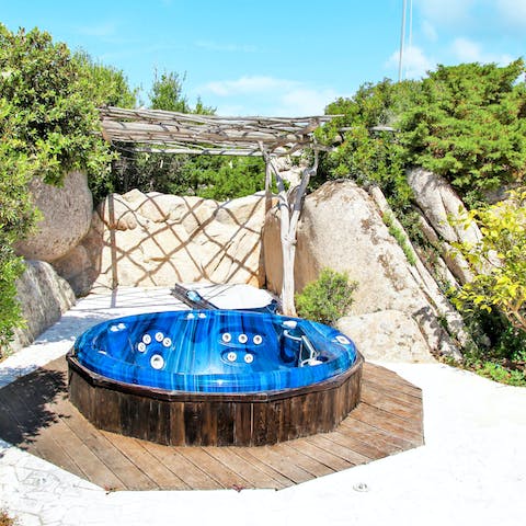 Soak in the secluded outdoor hot tub