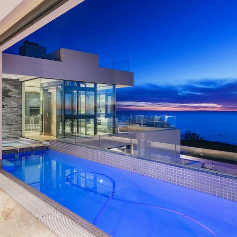 Dive into your private swimming pool just in time to watch the sunset