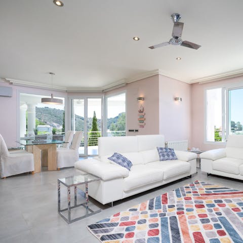 Open the terrace doors and feel the floral sea breeze through this stylish home