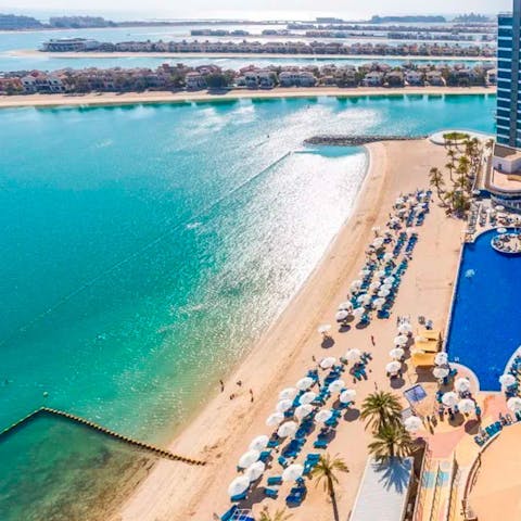 Soak up the Dubai sun from the resort's private beach