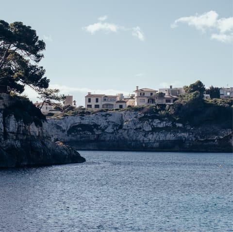 Visit the bay of Porto Cristo, about a 45 minute drive away