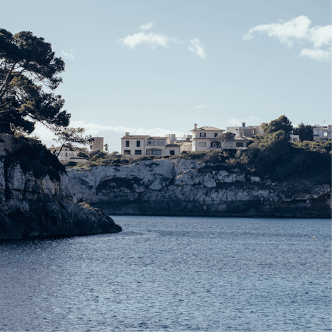 Visit the bay of Porto Cristo, about a 45 minute drive away