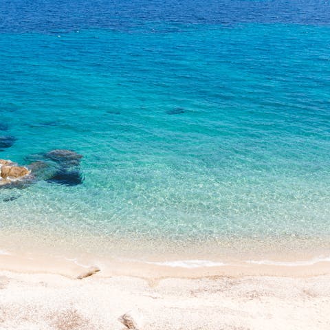 Stroll to Agios Stefanos Beach, ideal for sunbathing and watersports