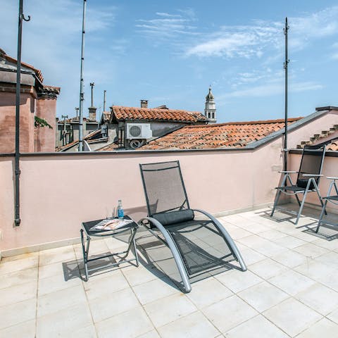 Soak up the Venetian sun on the communal solarium