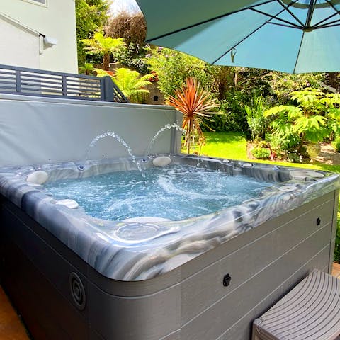 Crack open a bottle of something cold and enjoy in the home's hot tub